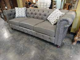 elegant grey linen tufted sofa has a