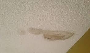 a popcorn ceiling with water damage