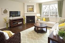 living room with a corner fireplace 33
