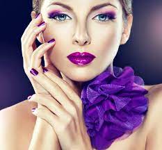 model with violet makeup and manicure