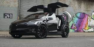 tesla s silly falcon wing doors have