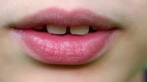 closeup view of cute pink lips of young