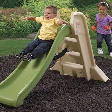 Smiling preschool boy sliding down slide and happy friend climbing up ladder. Naturally Playful Big Folding Slide Kids Slide Step2