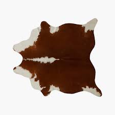 light brown and white cowhide area rug