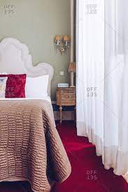 elegant hotel bedroom with red carpet