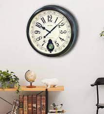 brown wooden pendulum wall clock by