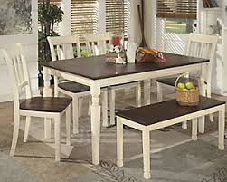 If you don't want the hassle of matching chairs to your table, then this round dining set takes out the guesswork. Dining Room Tables Ashley Furniture Homestore