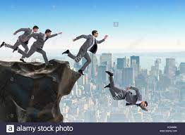 Business people falling off the cliff Stock Photo - Alamy