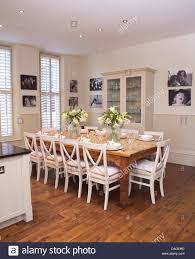 white chairs at simple wood table in