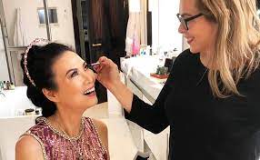 makeup artist putting latin america