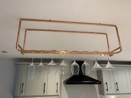 For the most part, it allows you to utilize the unused vertical space. Suspended Copper Wine Glass Rail Etsy