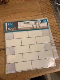 woman uses 40 home bargains tiles to
