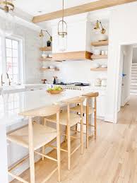 White and wood are natural complements, and white kitchens can look great with oak or walnut wood floors. White And Wood Kitchen Remodel Reveal Pinteresting Plans