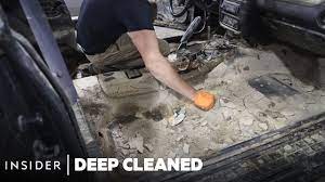 mud is deep cleaned from a flooded car