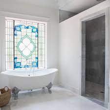 Classically modern leaded glass window design for the bathroom and staircase window to add privacy and beauty to the space. Photos Hgtv