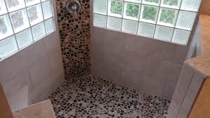 porcelain tile shower with pebble stone