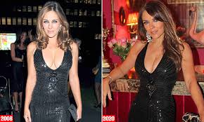 The dress was held together by several oversized gold safety pins. Elizabeth Hurley 54 Slips Into A Plunging Black Dress She S Owned For 15 Years Daily Mail Online