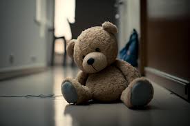 sad lonely teddy bear lying on the