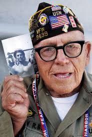 World War II Navy veteran Richard Osborn holds up an old photograph of himself at the 60th anniversary commemoration of the end of World War II held on ... - 70%2BYears%2BSince%2BJapan%2BLaunched%2BAttack%2BPearl%2BS5cSgcY0cXXl