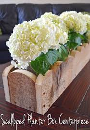 Line the bottom of the planter box with a single layer of river rock or pebbles. How To Build A Scalloped Planter Box Centerpiece