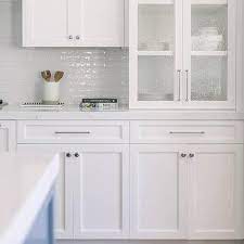 white shaker cabinet chrome hardware
