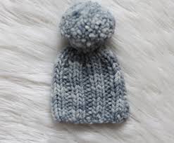 Two thick stripes and a giant fluffy pom pom adorn this simple hat. Newborn Ribbed Hat Free Knitting Pattern Hooked On Tilly
