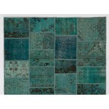 patchwork rug in shades of teal blue