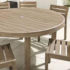 round wooden outdoor dining table