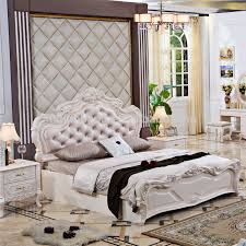 An impressive arched curved carved headboard and a bench seat are beautifully button tufted and covered in white fabric with nailhead trims. Pinkish White Painted French Style Bedroom Sets And Country Style Panel Furniture Buy French Style Furniture French Style Bedroom Sets Panel Furniture Product On Alibaba Com