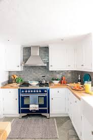 Let it sit for a few minutes. How To Clean Kitchen Cabinets Including Those Tough Grease Stains Better Homes Gardens