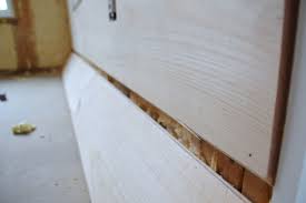 installing wood flooring on walls