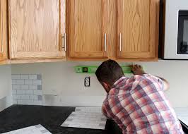 Install the tile sheets on the backsplash until you reach the first outlet. New Peel And Stick Subway Tile Backsplash Tag Tibby Design