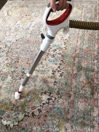vacuuming an area rug
