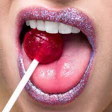 shimmering lips biting on lollipop
