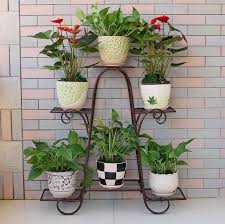 Many designs available from plant stands to hanging plant pots and large planters. Big Size 6 Pots European Balcony And Indoor Flower Pot Holder Garden Flower Stand Iron Flower Pergolas Flower Pergola Flower Pot Holderflower Stand Aliexpress Indoor Flower Pots Plant Pot Decoration Indoor Flowers