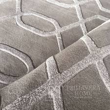 a modern gray rug with a geometric