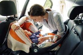 how to put a baby into a car seat properly