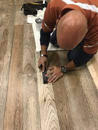 wood floor repair removing a wet
