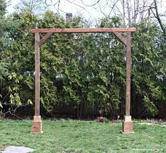 This classic wood arbor is beautiful for a backyard wedding arch or just everyday backyard decor! Diy Self Standing Wood Arch Jaime Costiglio