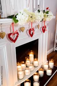 A Cozy White Fireplace With Lots Of