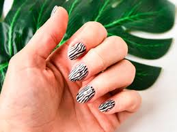wild zebra print nails as trend of 2023