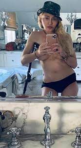 Madonna Goes Topless in Mirror Selfie While Posing with Crutch