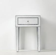 • the inside of the cabinet is made up of a practical shelf and a drawer for small items. One Drawer Mirrored Side Table