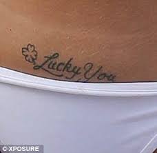 Tulisa FINALLY reveals her hidden tattoo in Marbella... a tacky 'Lucky You'  inking along on her bikini line | Daily Mail Online