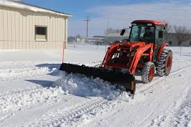 snow removal with a tractor snow plow