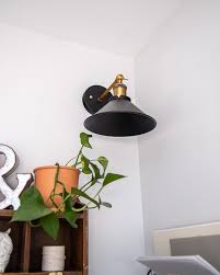 The only real difference is that wall sconces may have special mounting brackets attached to the electrical box to support the weight of the upright light fixture. How To Install Wall Sconces Without An Electrician Maria Louise Design