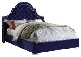 navy velvet on tufted queen bed