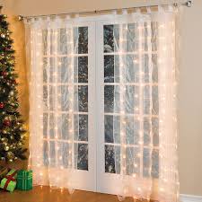 Light Up Sheer Drapery Perfect For Christmas Www Themerrywindow Com Drapes Windows Window Decorating With Christmas Lights White Paneling Cool Curtains