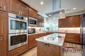 At the white kitchen company we specialise in solid wood kitchens, all of our cabinets are made out of solid european oak or tulip hardwood (where needed). Oak Custom Cabinets Trifection Remodeling Construction