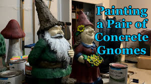 painting concrete gnome statues from